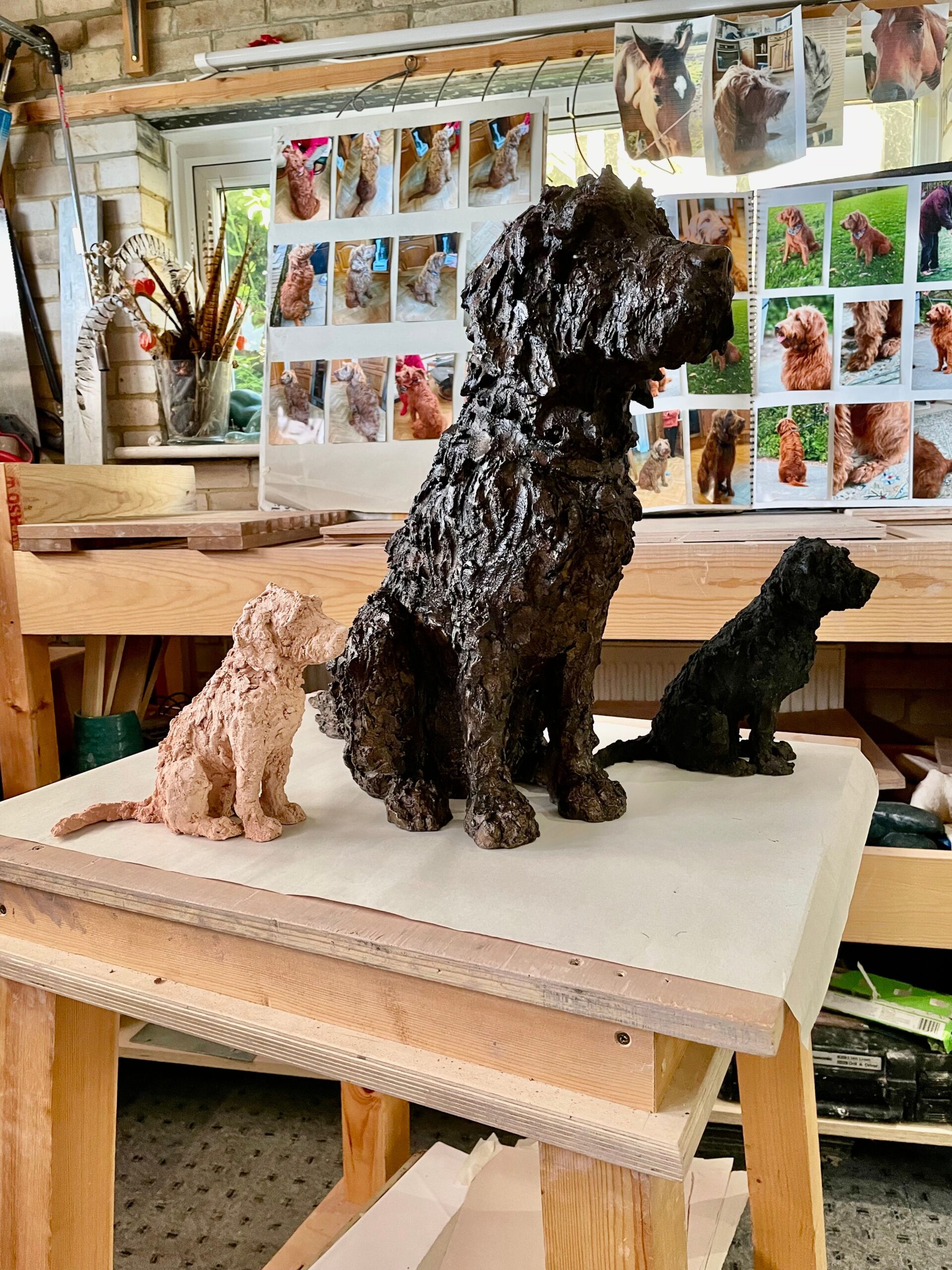 Jess — two-thirds life size bronze Labradoodle with miniature studies
