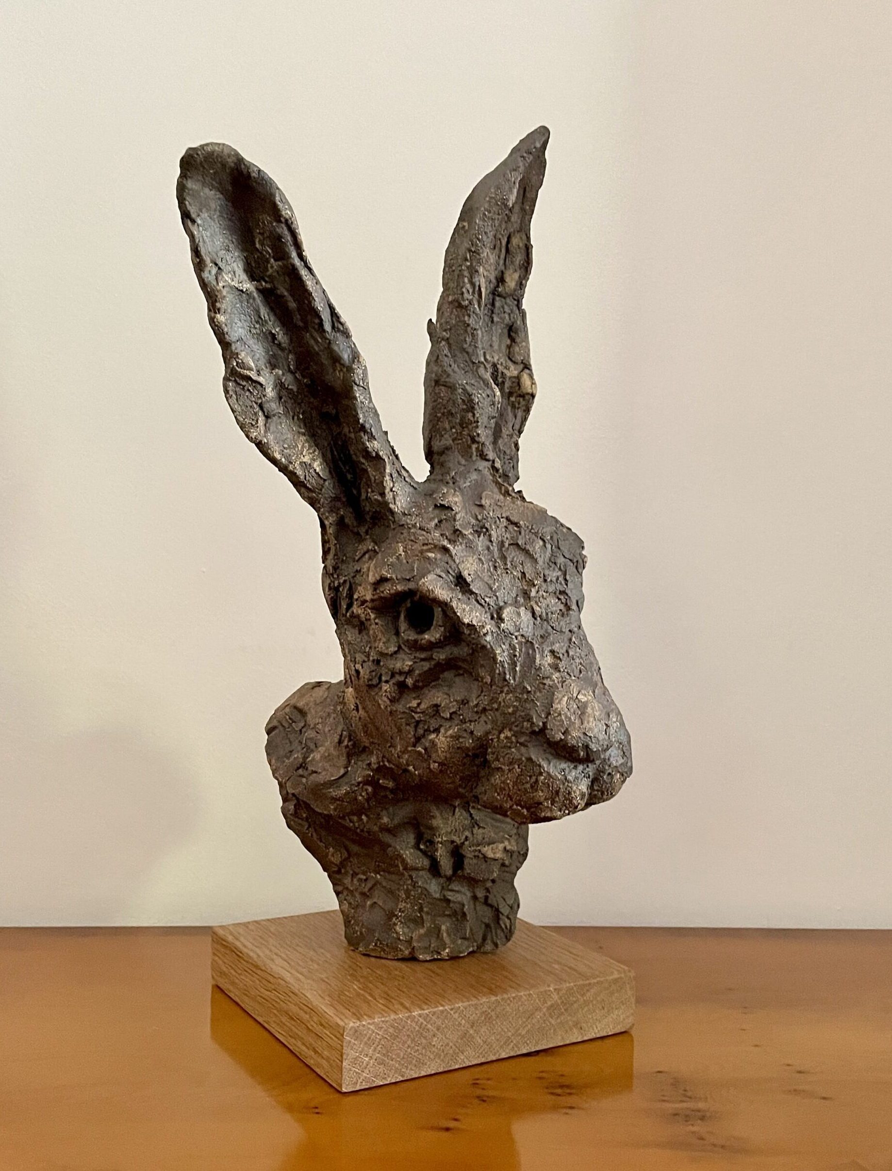 Ceramic hare's head mounted on hardwood